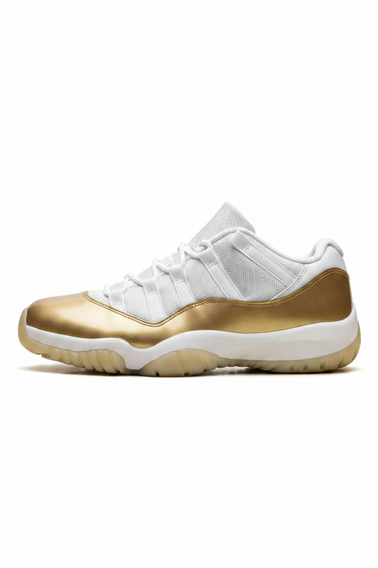 A single Air Jordan 11 Retro Low sneaker in metallic gold and white, shown from the side profile against a clean white background.